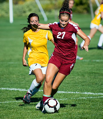 women playing football